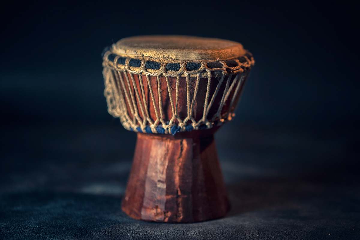 leisure activities selective focus photography of brown djembe instrument drum